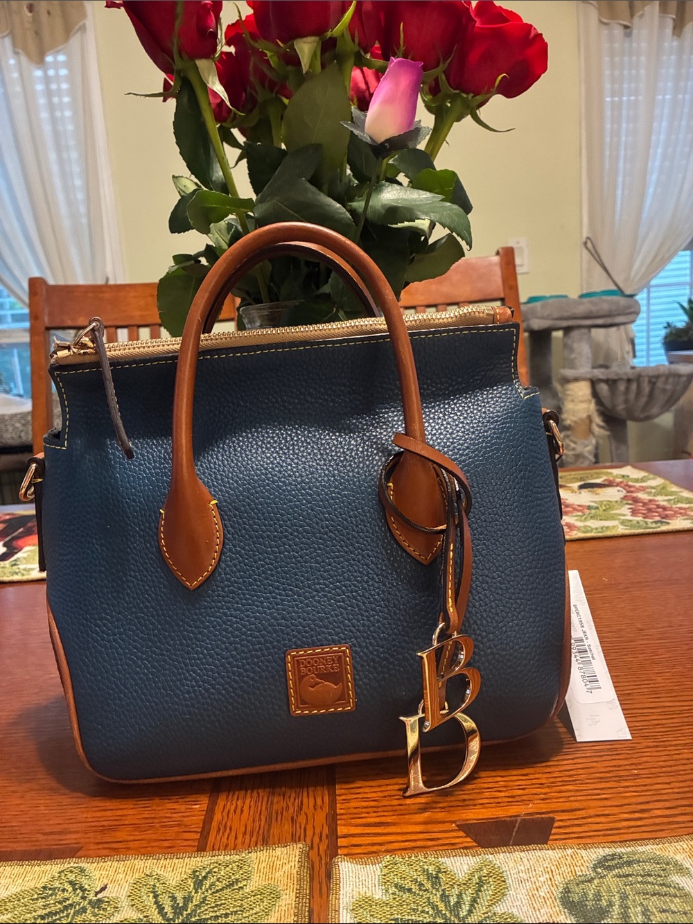 Dooney & Bourke Blue Pebbled Leather Satchel with Brown Trim and Gold Charm